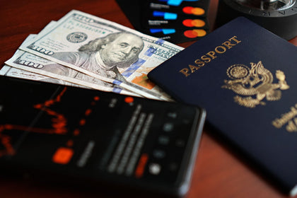 Passport, currency and cards laid out for a trip