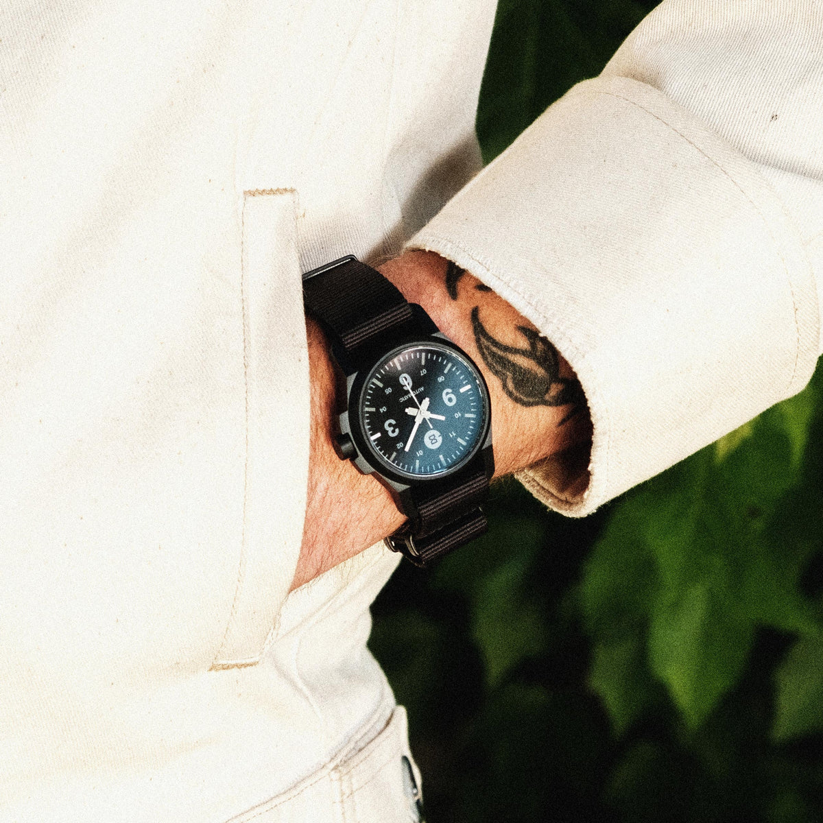 Field 1S in black on the wrist
